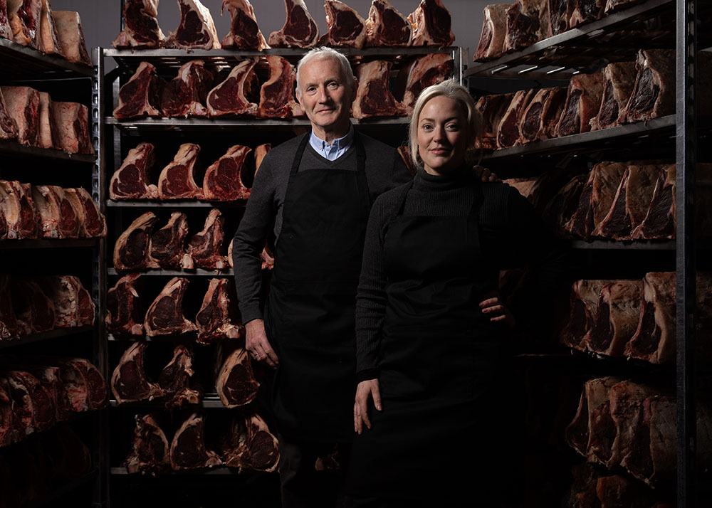 Pat and Kate McLoughlin Butchers in a meat storage area